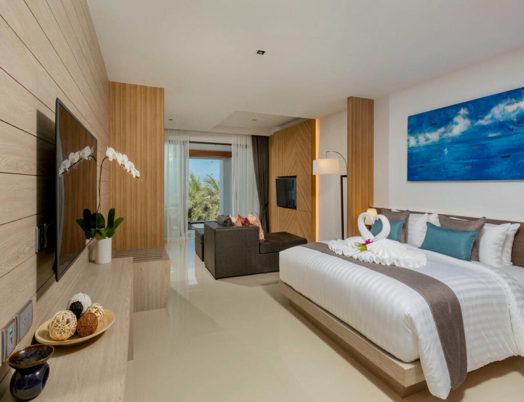 Another angle of the Deluxe Twin Room bedroom, highlighting its spacious layout and relaxing ambiance