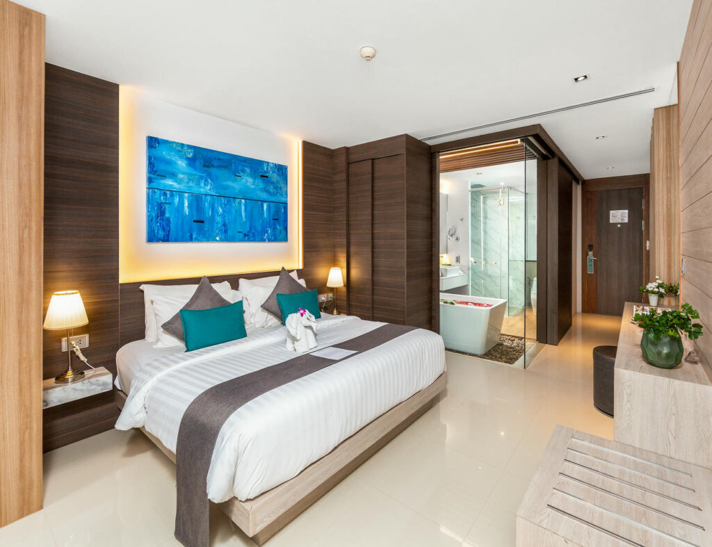 Deluxe Twin Room featuring a view of both the bedroom and the connected bathroom