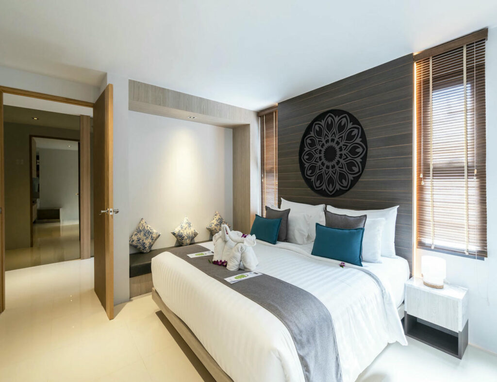 Spacious Deluxe Twin Room interior showing the full room size and layout.