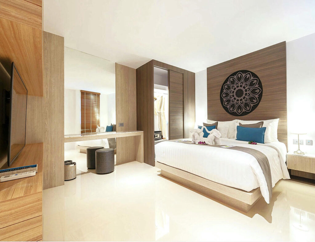 Cozy Deluxe Twin Room bedroom setup with stylish interior at Kudo Hotel