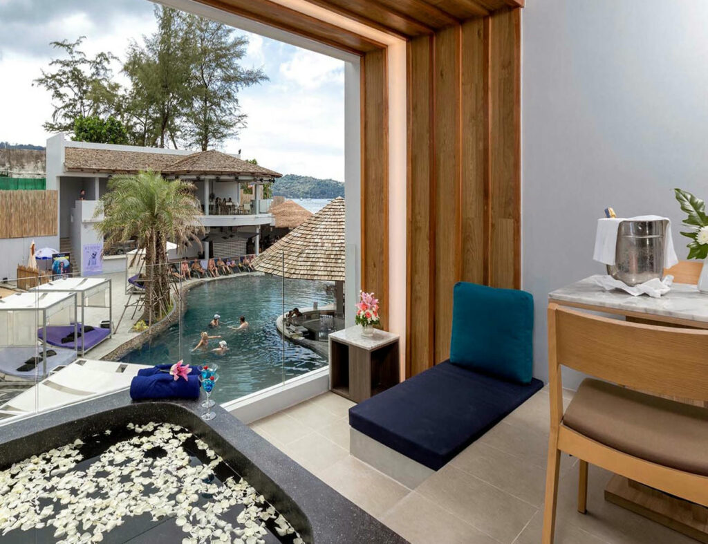 Pool view balcony and private jacuzzi from Deluxe Twin Room at Kudo Hotel