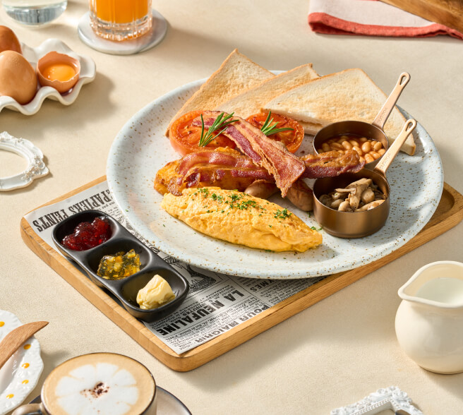 Breakfast served on the beach at Kudo Hotel with fresh dishes and ocean views