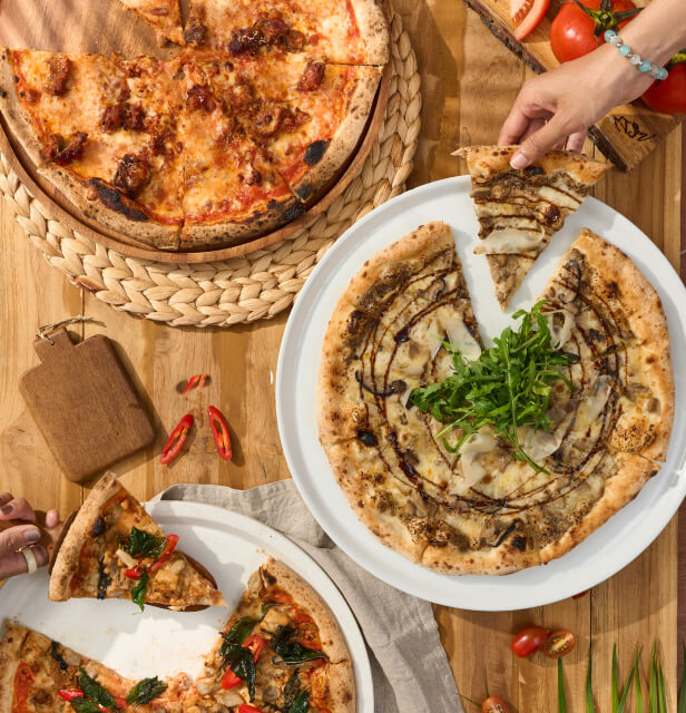 Pizza menu selection from Kudo Hotel’s Dine & Drink featuring various gourmet pizzas